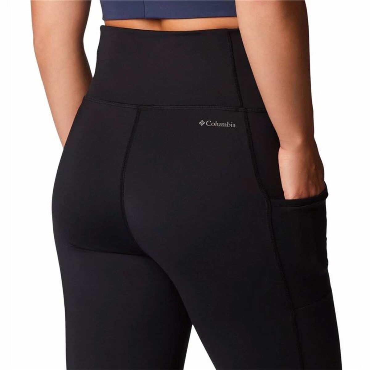 Women in black Columbia Windgates™ sport leggings, ideal for outdoor adventures and camping activities.