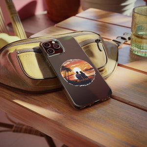 Phone case with sunset design, placed on a table, ideal for outdoor adventures and camping, available at revlando.com.