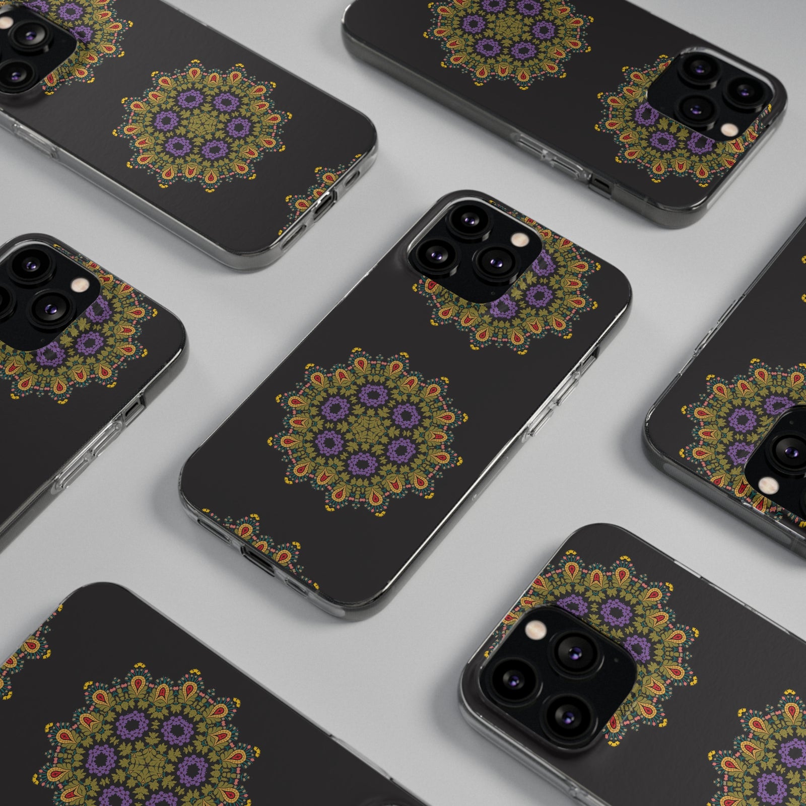 Gold mandala phone cases arranged on a surface, perfect for outdoor adventures and camping trips.