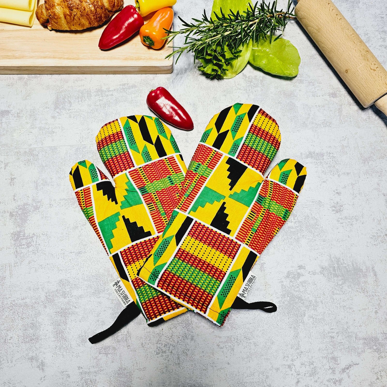 Set of 2 handmade African print oven gloves with colorful geometric patterns, ideal for outdoor cooking and camping.
