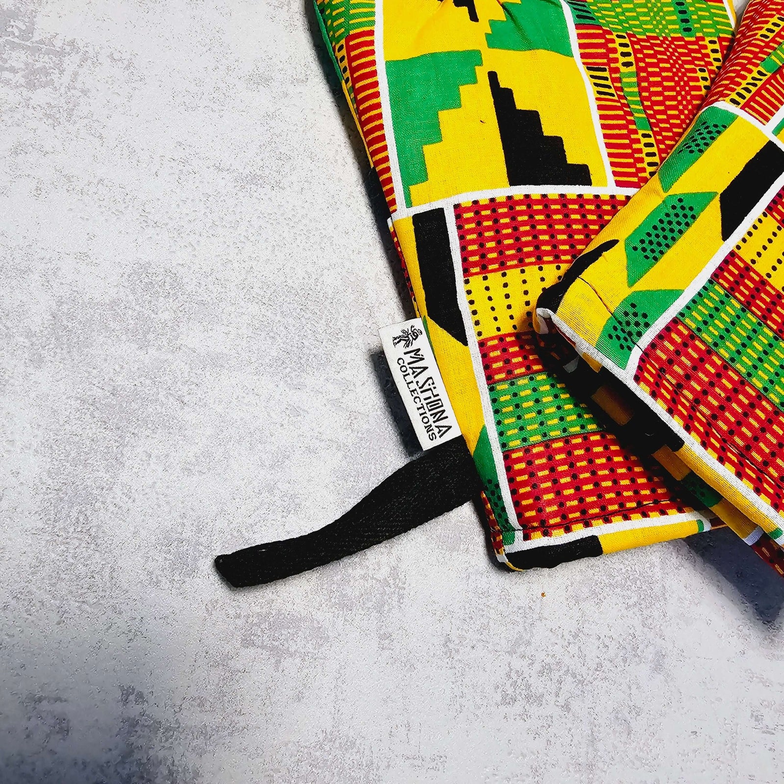 Set of 2 handmade African print oven gloves with colorful geometric patterns, ideal for outdoor cooking and camping.