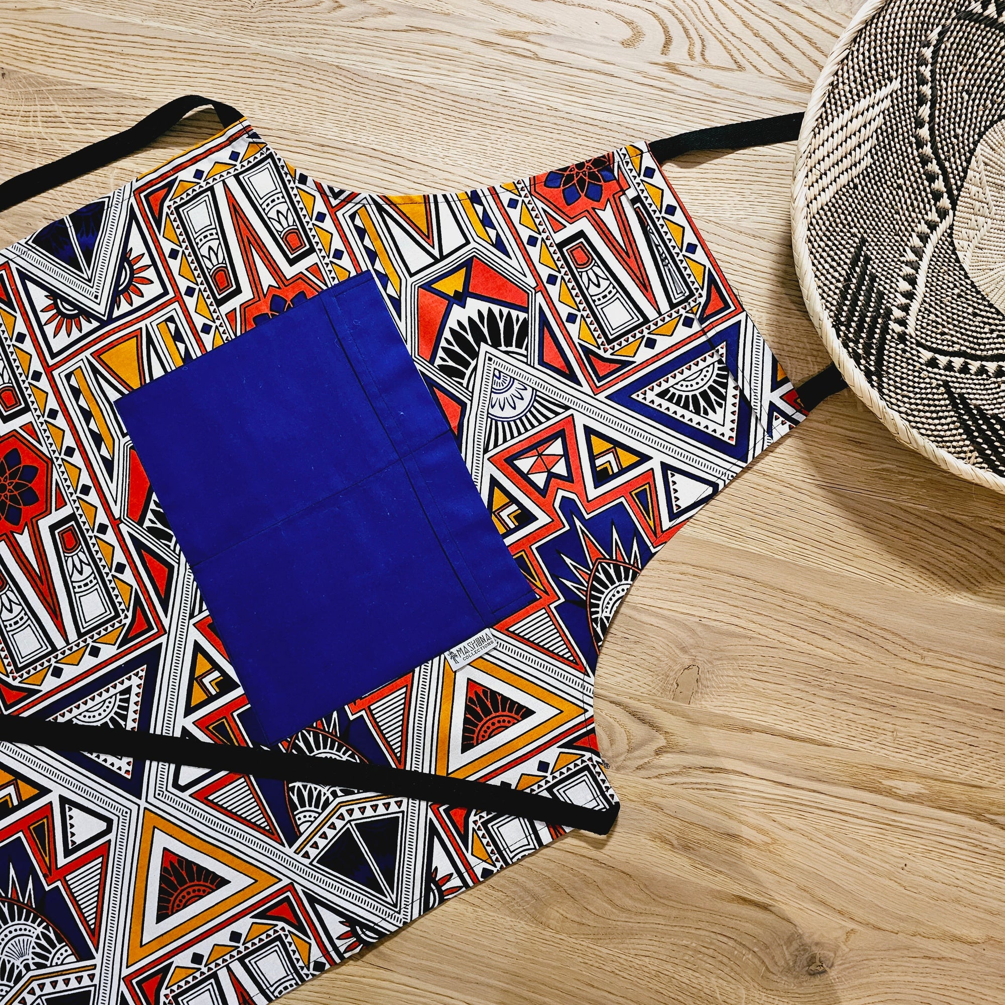 Handmade African Print Apron and matching oven gloves set in vibrant colors, perfect for outdoor and camping adventures.