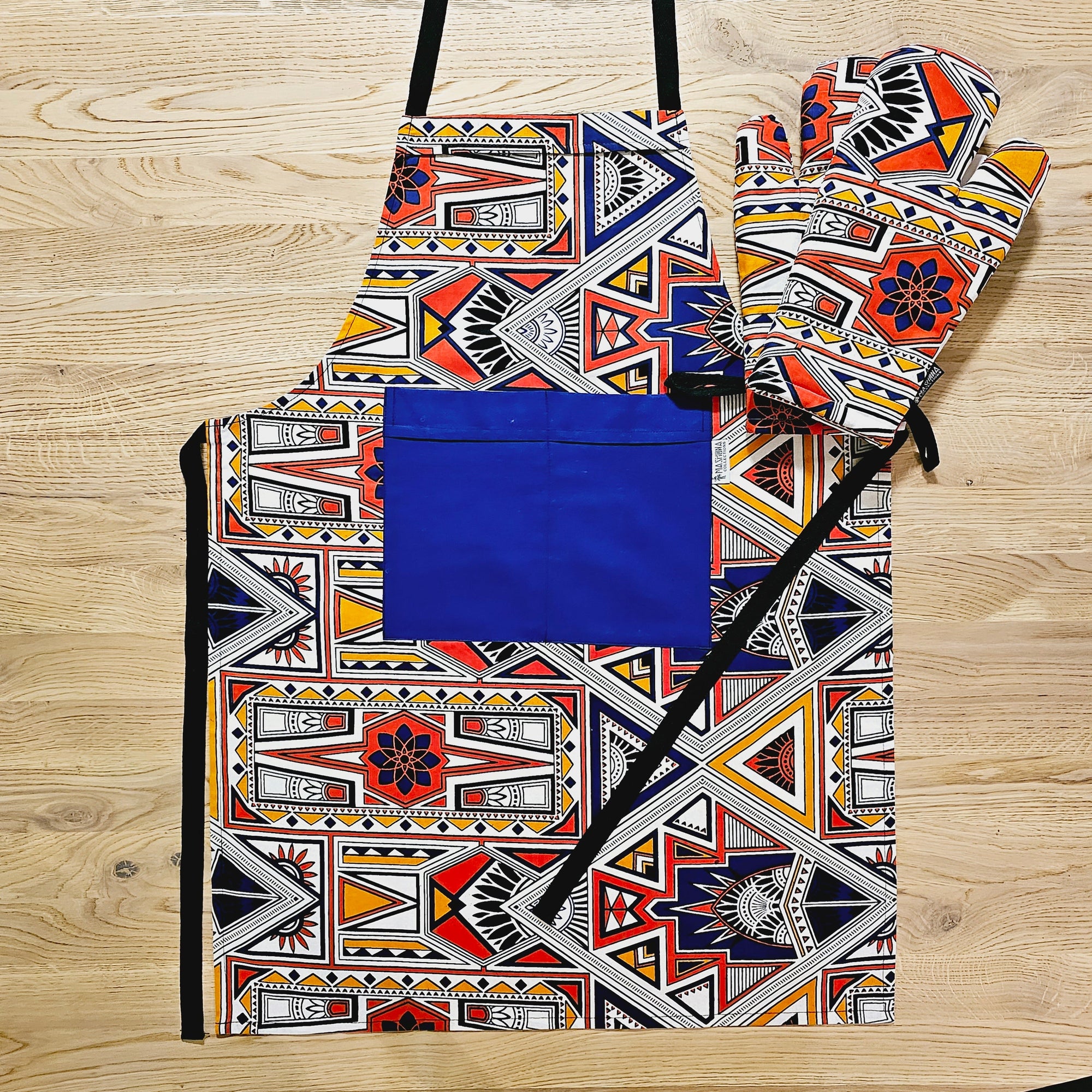 Handmade African Print Apron and matching oven gloves set in vibrant colors, perfect for outdoor and camping adventures.