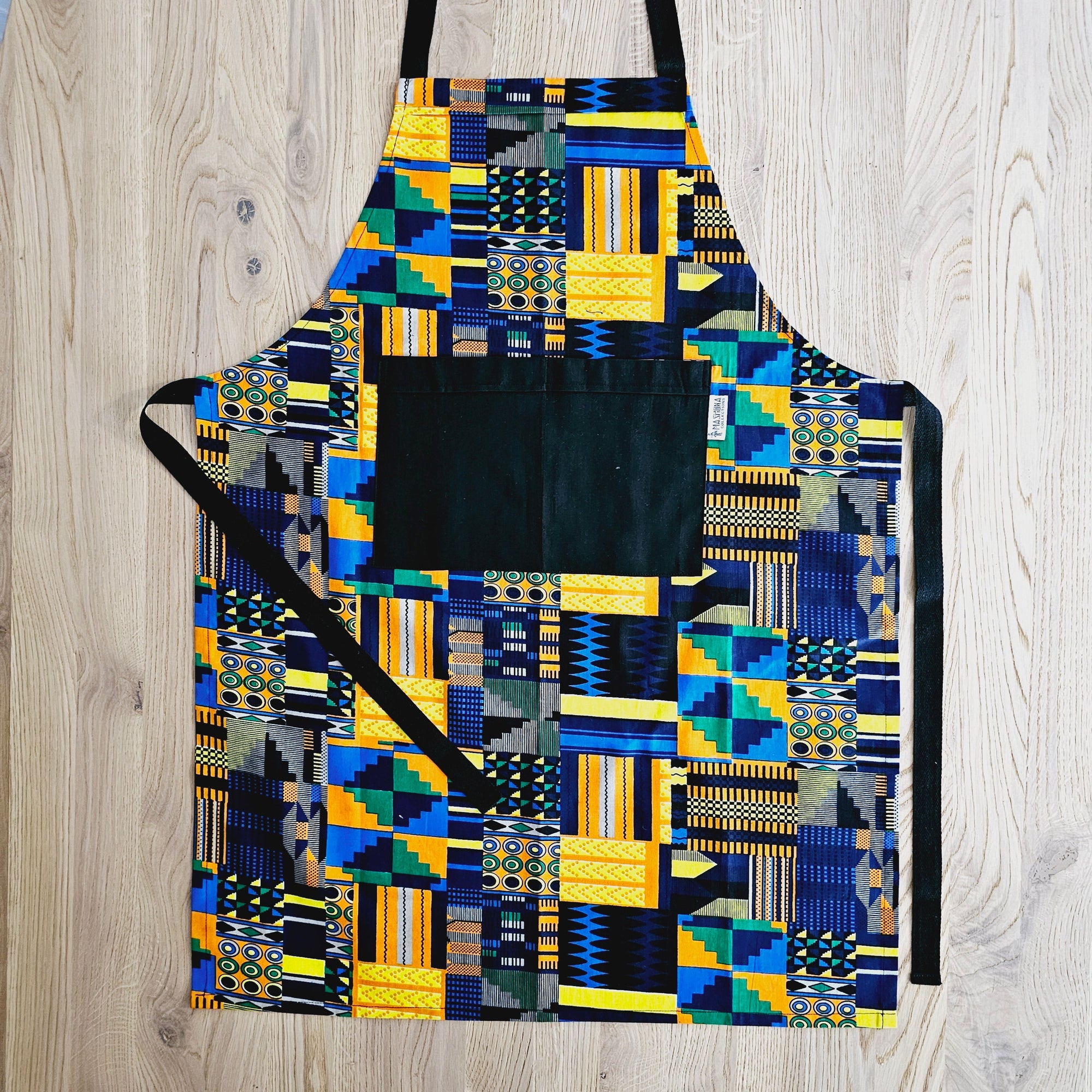 Handmade African print cotton apron with matching oven gloves, ideal for outdoor cooking and camping adventures.