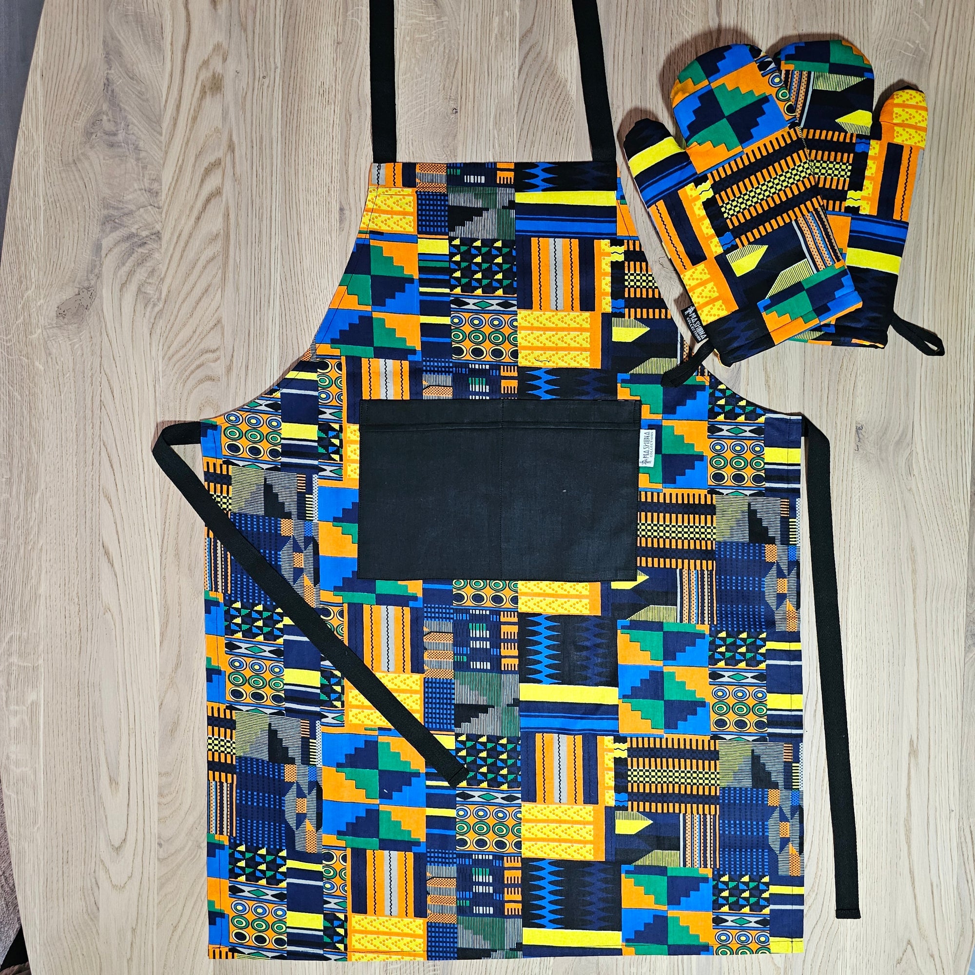 Handmade African print cotton apron with matching oven gloves, ideal for outdoor cooking and camping adventures.