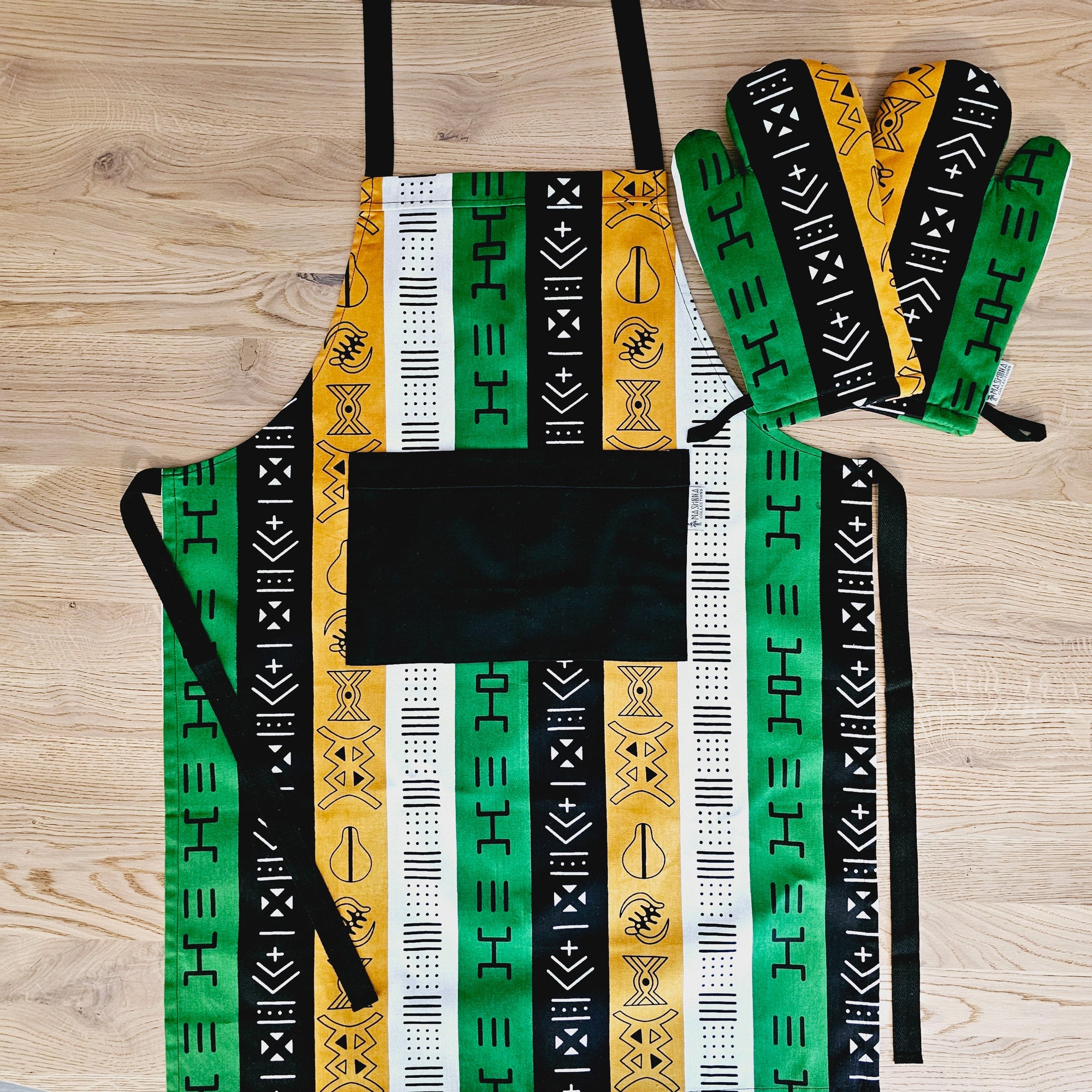 Colorful handmade apron and matching oven gloves set made from 100% cotton African print fabric, perfect for outdoor cooking adventures.