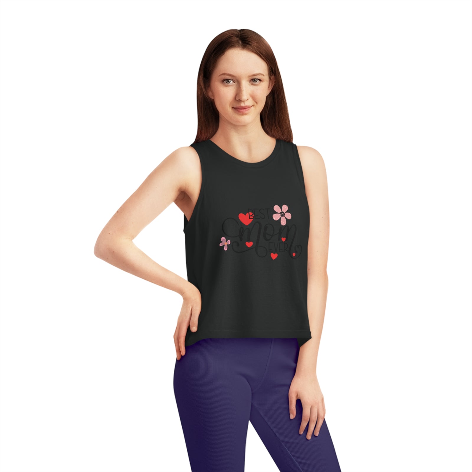 Model wearing women's cropped tank top with floral and heart design, perfect for outdoor adventures and casual outings.