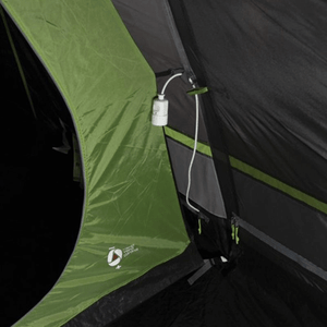 Interior view of High Peak Brixen 4.0 tent showcasing the power outlet and green fabric details for camping convenience.