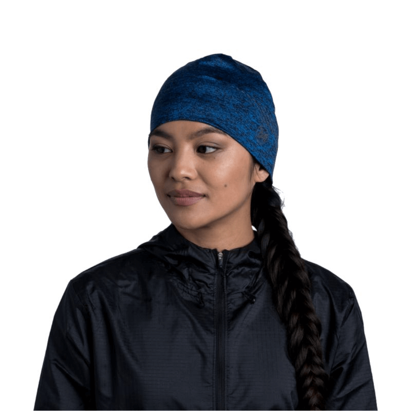 Buff Dryflx Beanie in navy on a woman, showcasing lightweight and flexible design for outdoor sports and adventures.