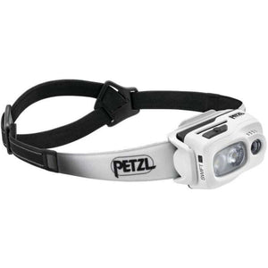 Petzl LED head torch in white with adjustable strap, ideal for outdoor adventures and camping.