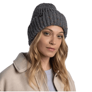 Buff Kim Knitted Fleece Beanie in gray worn by a woman, perfect for outdoor sports and winter adventures.