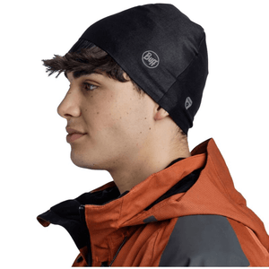 Black Buff Thermonet Beanie on a man, showcasing thermal insulation for outdoor winter sports and adventure.