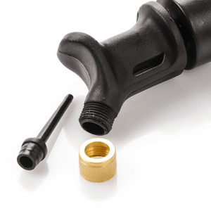 Close-up of Meteor Double Action ball pump nozzle and accessories for outdoor sports and travel.