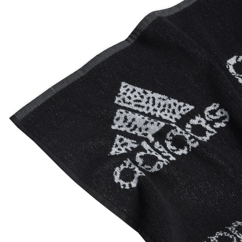 Close-up of Adidas HS2056 sports towel, featuring a black and white design, perfect for outdoor sport and travel activities.