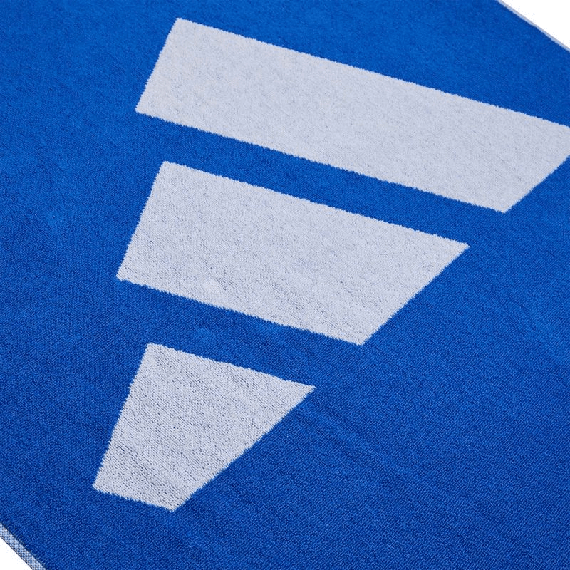 Close-up of Adidas 3BAR L Towel featuring blue background and white logo design, ideal for sports and outdoor activities.