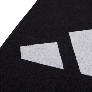 Close-up of Adidas 3BAR L Towel with black and white design, showcasing premium cotton texture and sporty style.