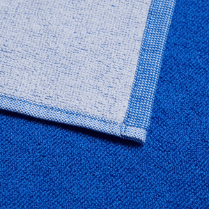 Close-up of Adidas 3BAR L Towel showcasing premium cotton texture in blue and white, perfect for sports and outdoor activities.