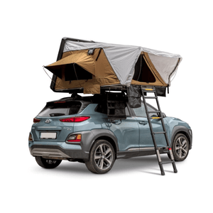 Offlander Fold 2 Sand Roof Tent mounted on a car, showcasing an adventure-ready setup for outdoor travel.