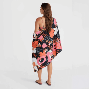 Woman holding O'Neill Mix & Match Seacoast Towel, showcasing its vibrant floral design, perfect for outdoor adventures.