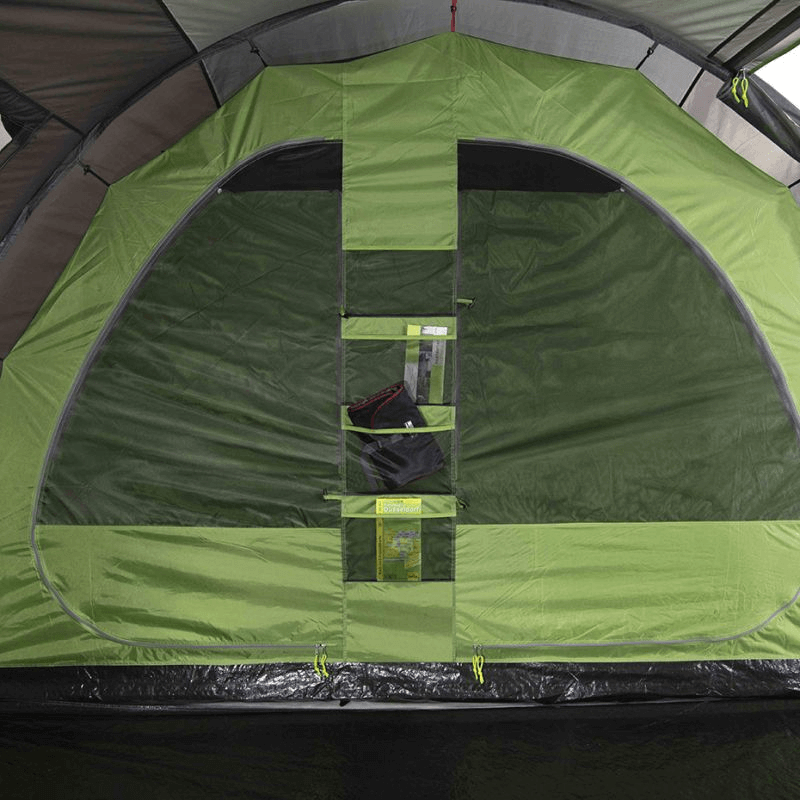 Interior view of the High Peak Ancona 4.0 tent featuring spacious design and convenient storage pockets for outdoor adventures.