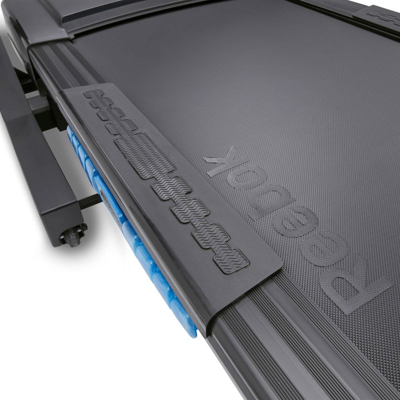 Close-up of Reebok JET 300 treadmill surface highlighting advanced cushioning and grip for optimal performance and comfort.