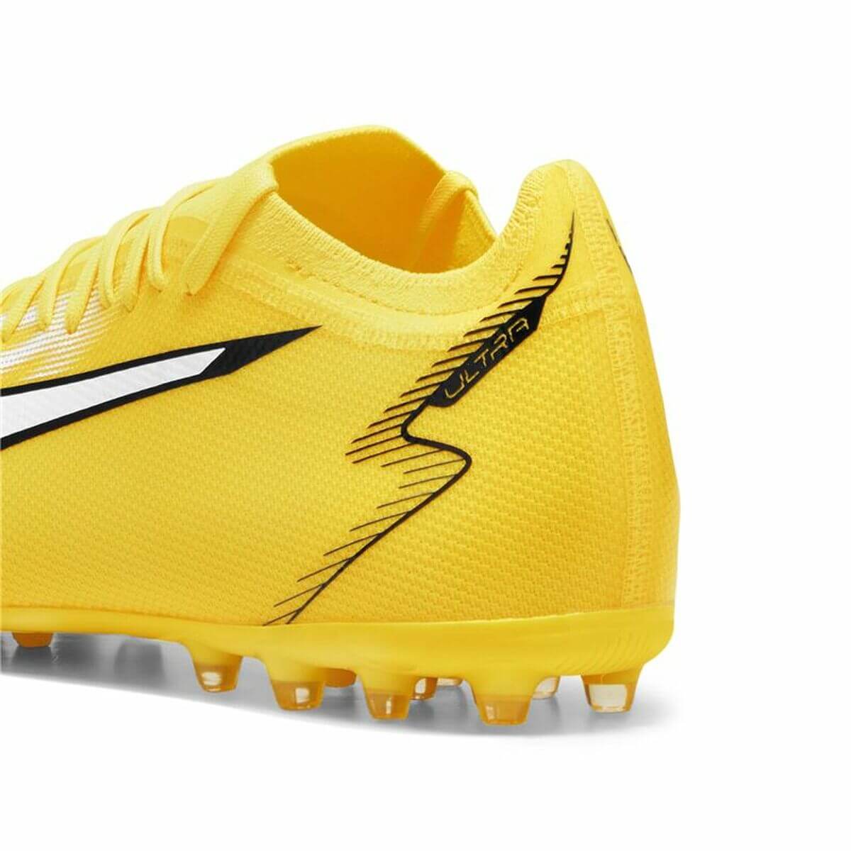 Adult's Puma Ultra Match MG football boots in yellow, perfect for outdoor sports and adventures. Available at revlando.com.