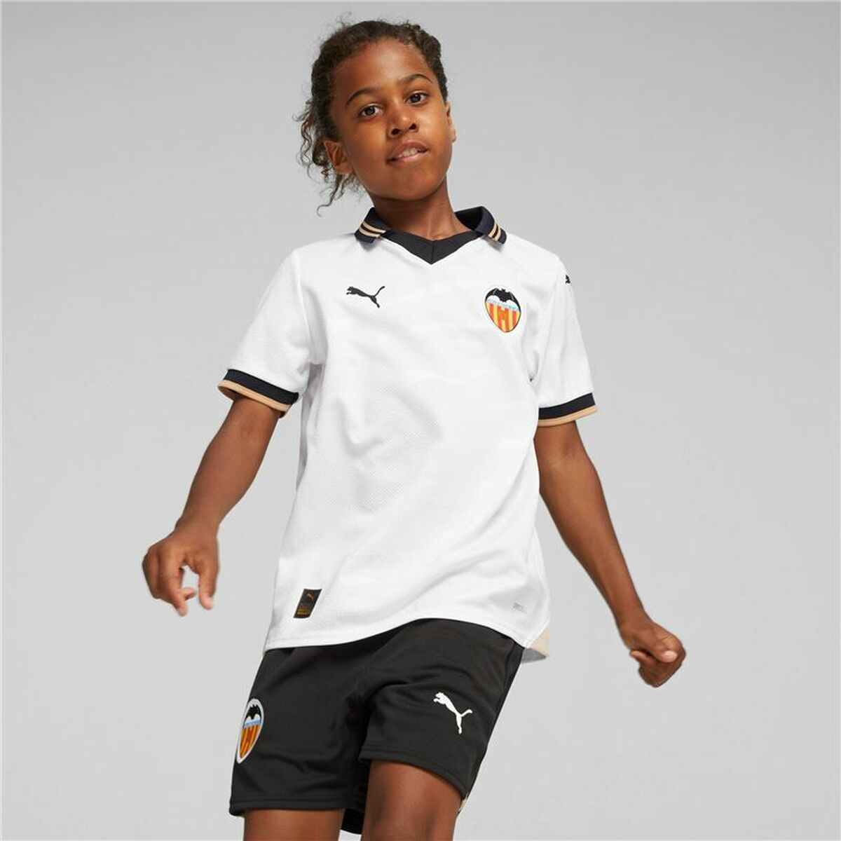 Children's short sleeved football shirt in white by Puma for outdoor sports and adventures, available at revlando.com.