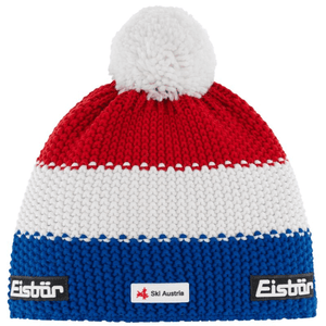 Eisbar Star Pompon Ski Cap in red, white, and blue with pompom, ideal for outdoor sports and winter adventures.