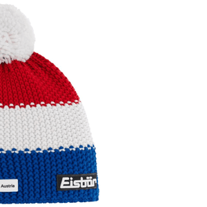 Eisbar Star Pompon Ski Cap in red, white, and blue with pompom, ideal for outdoor sports and winter adventures.