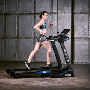 woman running on Reebok JET 300 treadmill showcasing fitness and advanced technology for outdoor sports and adventure.