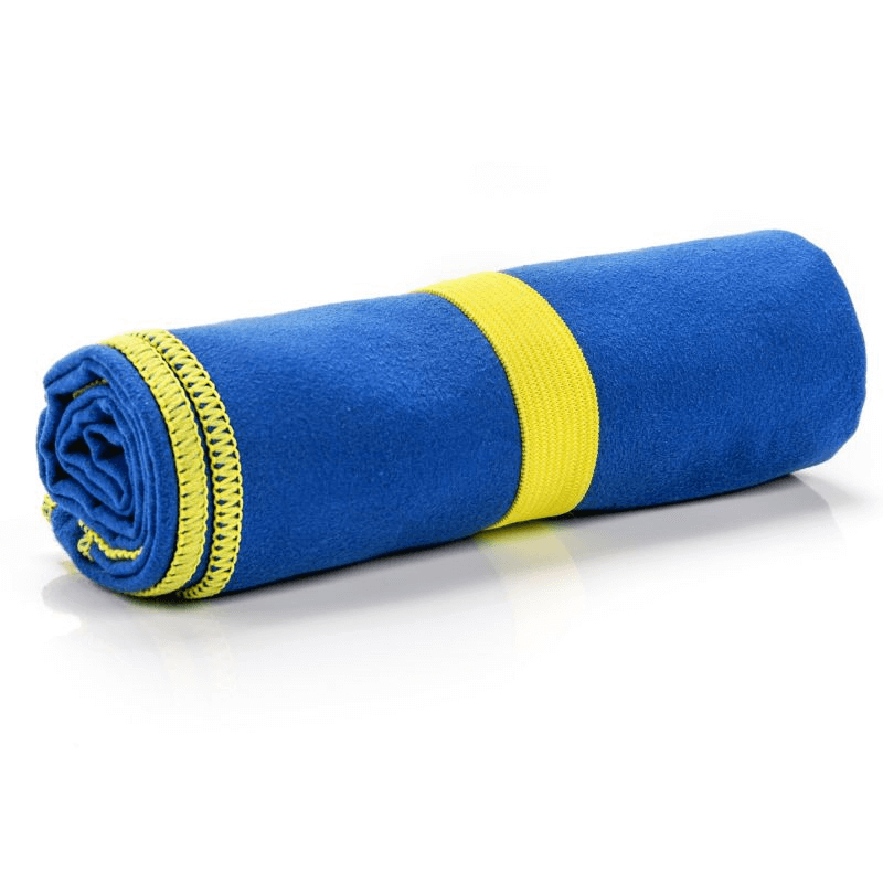 Meteor Navy Microfiber Towel rolled, lightweight and compact, ideal for outdoor activities and travel adventures.