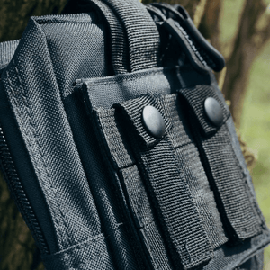 Close-up of Offlander Molle Tactical Pouch in black, featuring durable nylon and secure fastening for outdoor adventures.