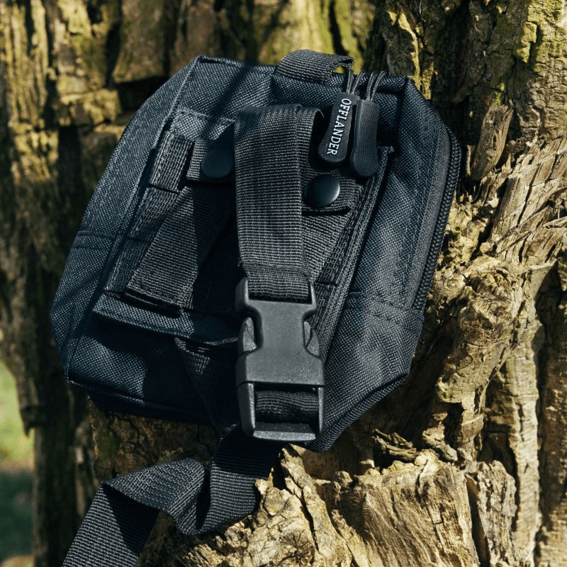 Offlander Molle Tactical Pouch in black secured to a tree, ideal for outdoor sports and adventures.