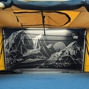 interior view of Offlander Fold 2 roof tent with mountain and sun graphic, perfect for outdoor adventures.