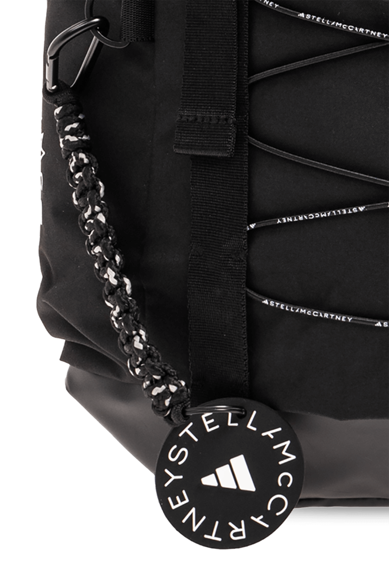 Close-up of ADIDAS by Stella McCartney backpack showing decorative lacing and logo tag, ideal for outdoor and sport adventures.