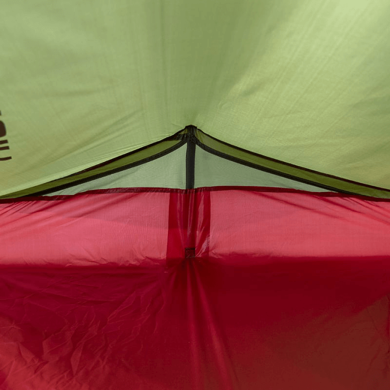 Interior view of the High Peak Siskin 2 Tent showcasing its durable red and green materials, perfect for outdoor adventures.