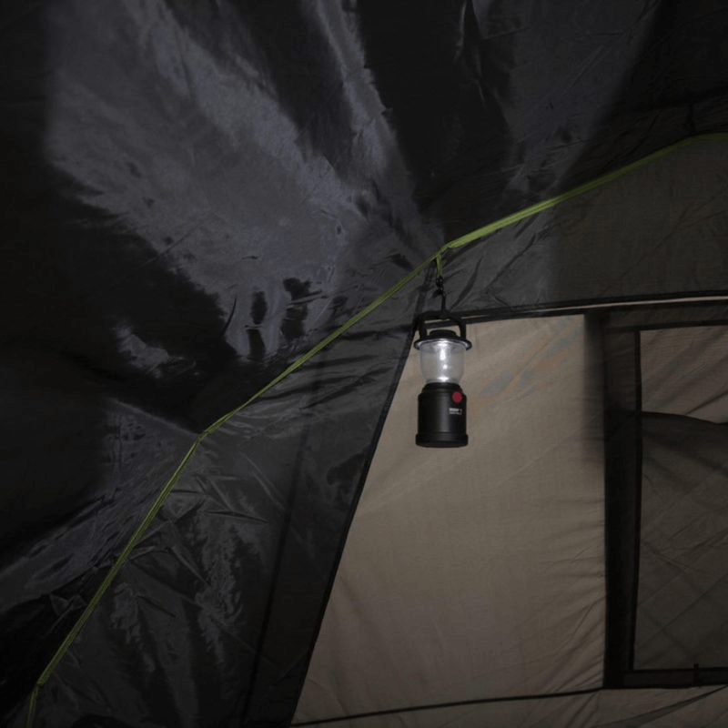 Interior view of High Peak Brixen 5.0 tent with a hanging lantern, showcasing spacious camping comfort for outdoor adventures.