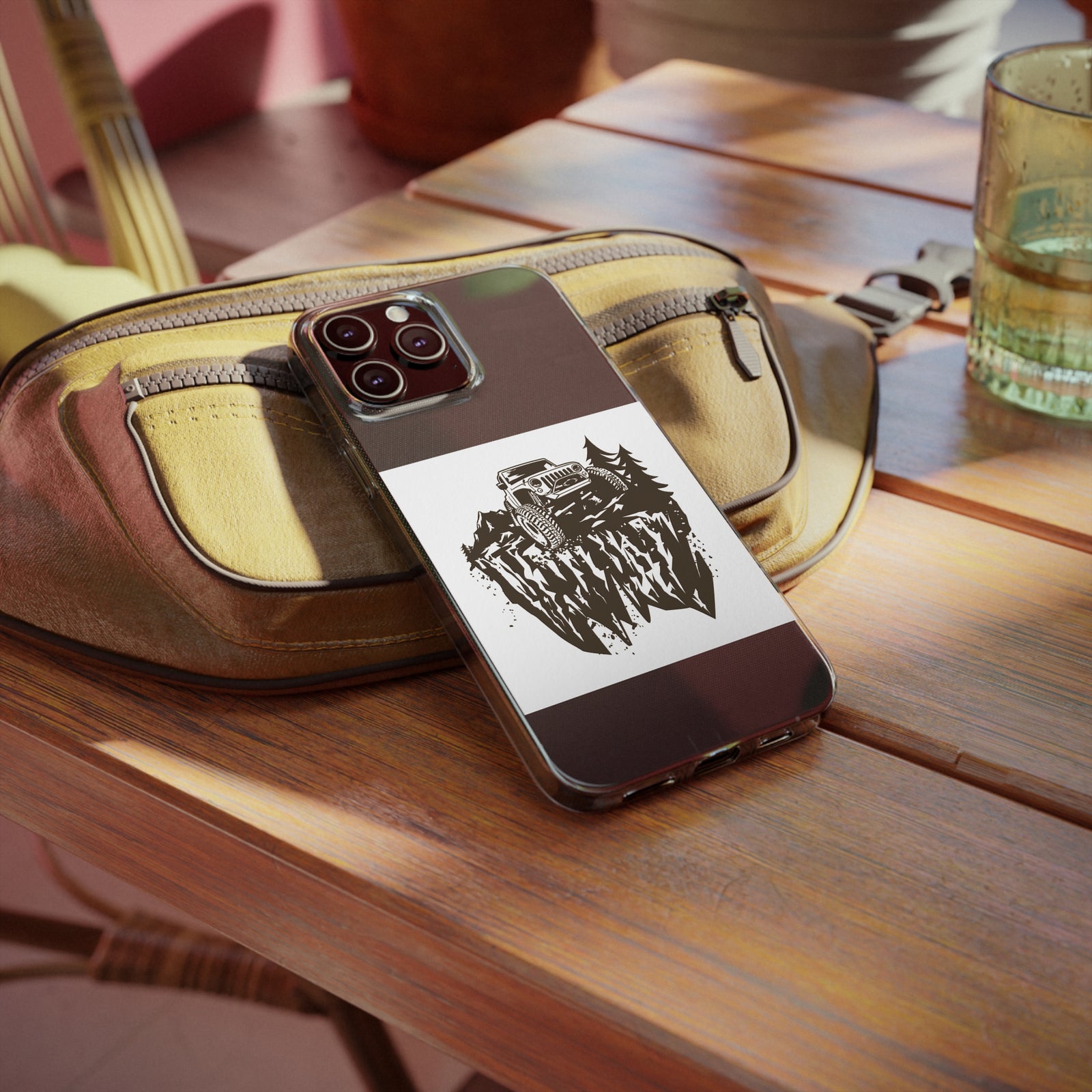 Jeep-themed phone case on a wooden table, perfect for outdoor adventures and camping. Available at revlando.com.