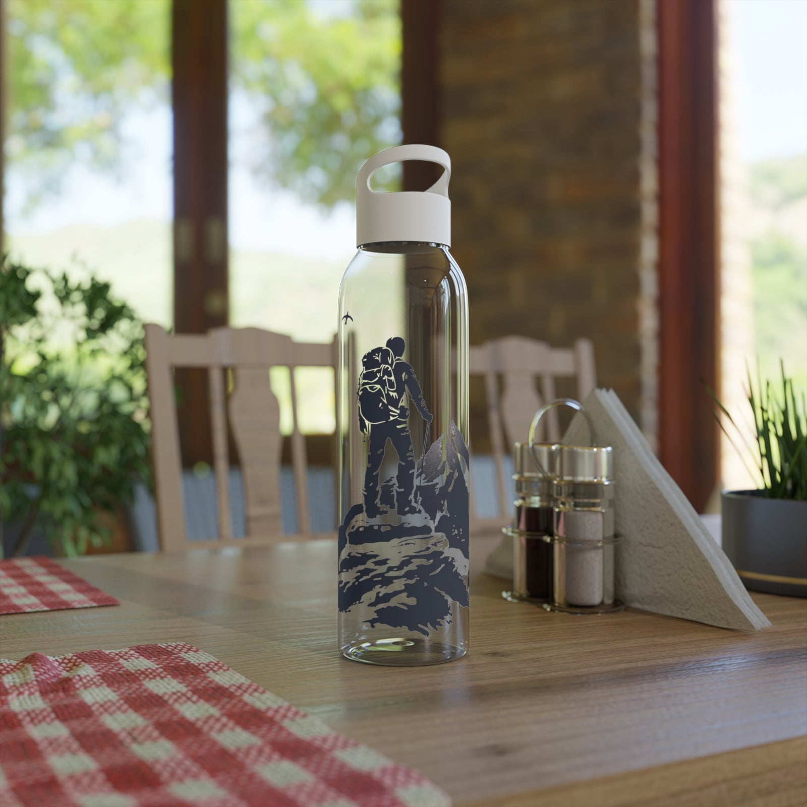 Sky Water Bottle on a wooden table, perfect for outdoor adventures and camping, showcasing durability and style.