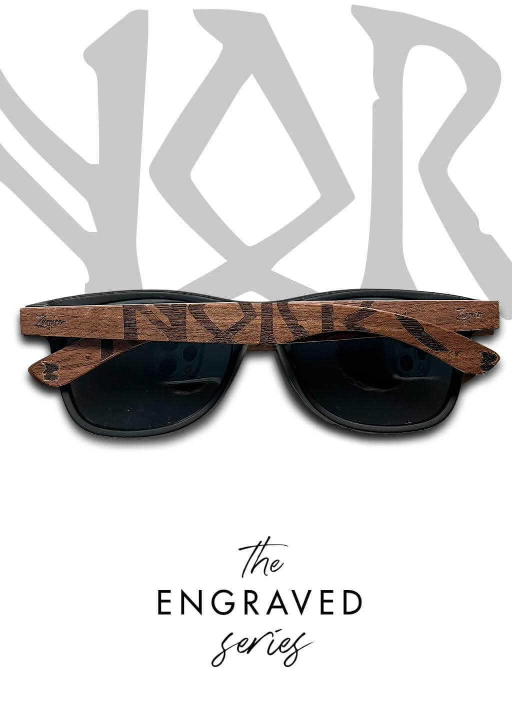 Handheld Eyewood engraved wooden sunglasses with Viking runes, perfect for outdoor adventures and camping.