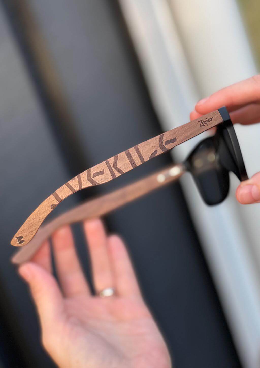 Eyewood engraved wooden sunglasses with Viking runes, perfect for outdoor adventures and camping.