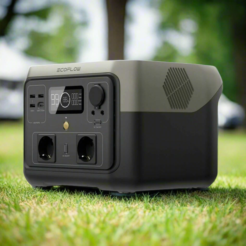 Portable Solar Generator Ecoflow on grass, ideal for outdoor adventures and camping with 500-1000 W power.