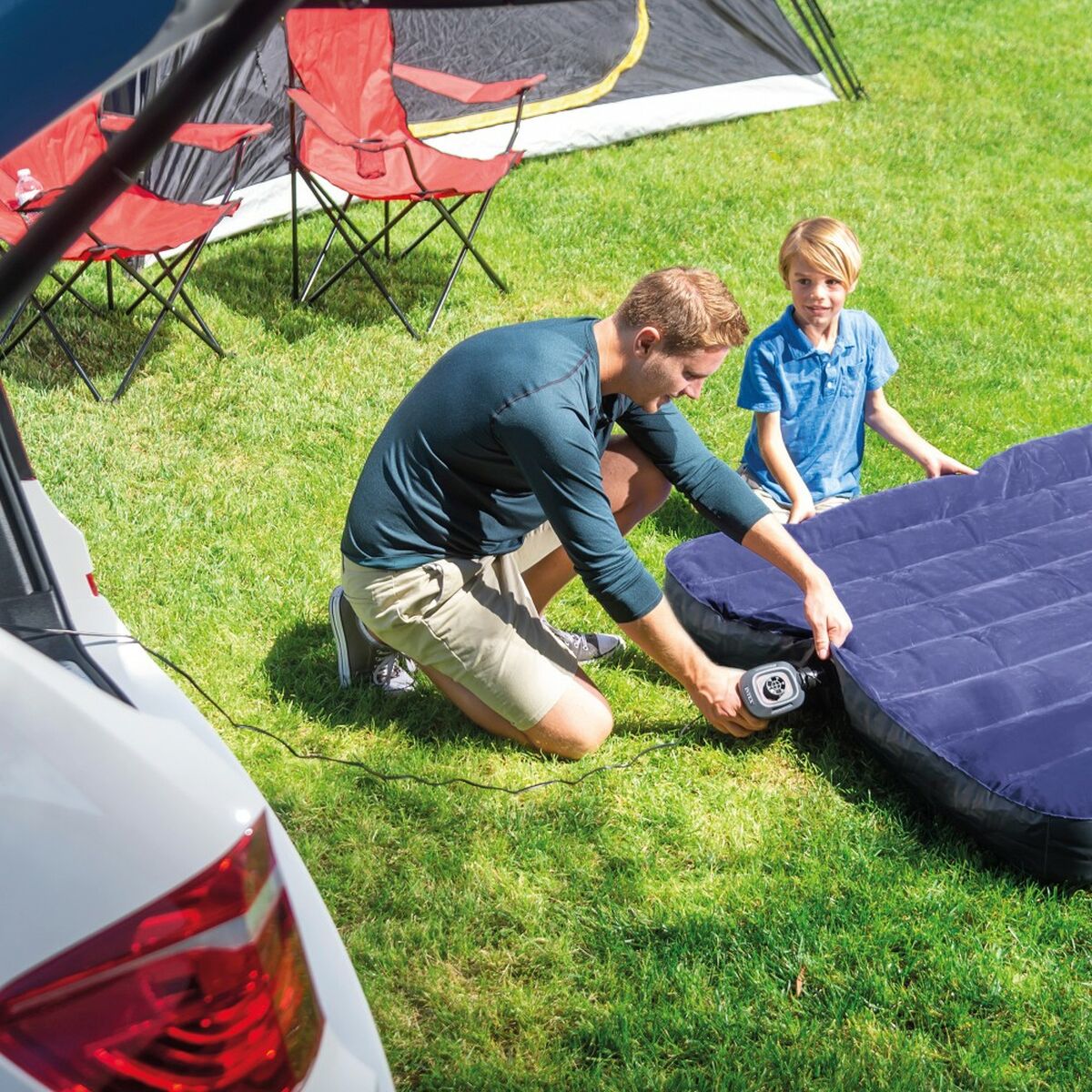 Intex Electric Air Pump with interchangeable nozzles and car adaptor, perfect for outdoor camping adventures.