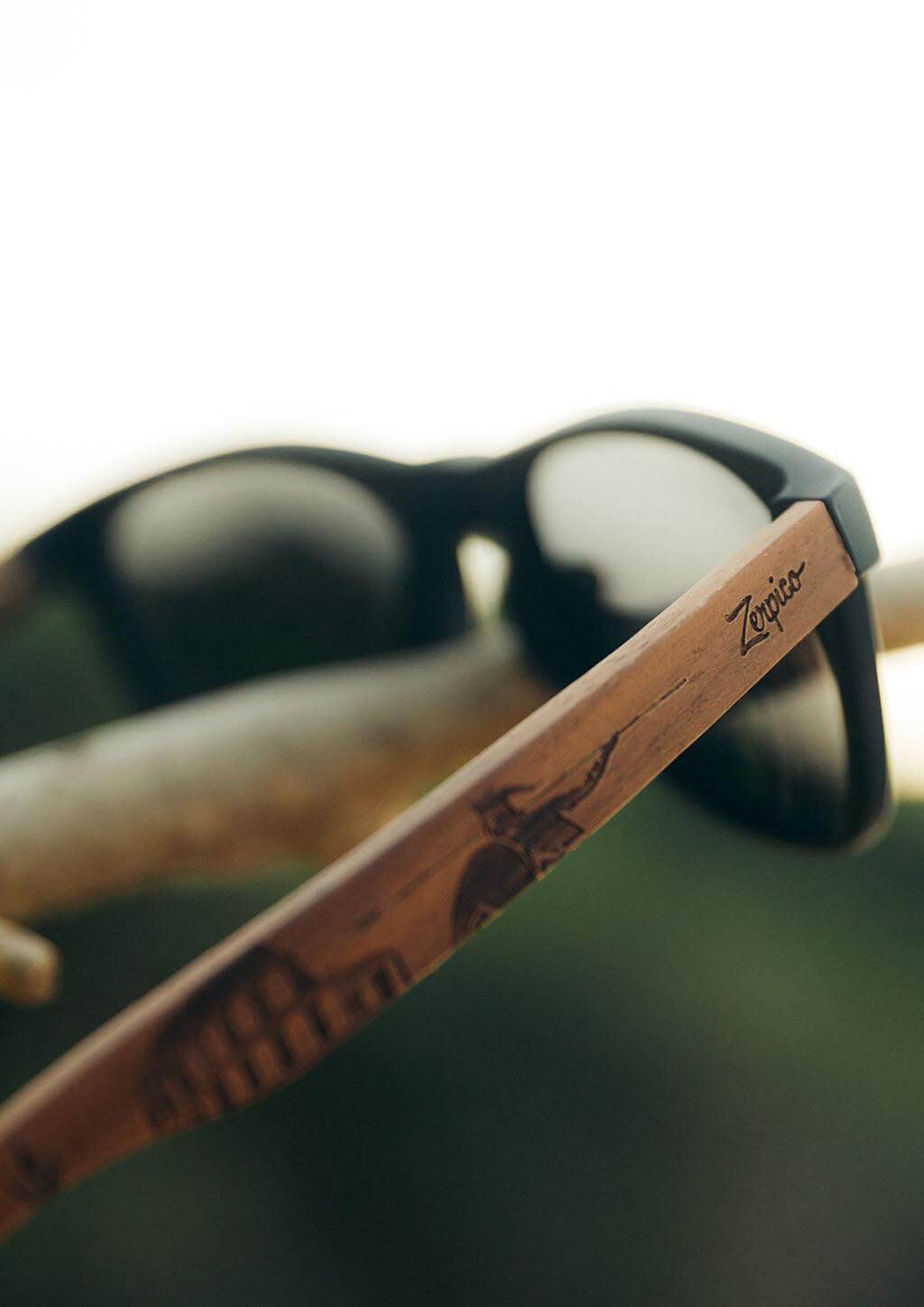 Engraved wooden sunglasses with a stylish design, perfect for outdoor adventures, featured at revlando.com.
