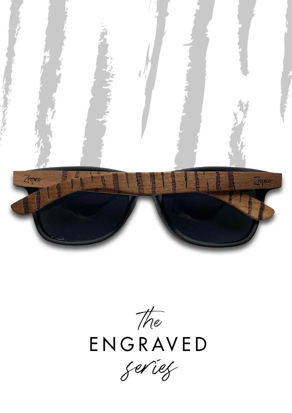 Engraved wooden sunglasses arm resting on a woven basket, showcasing unique design for outdoor adventures.