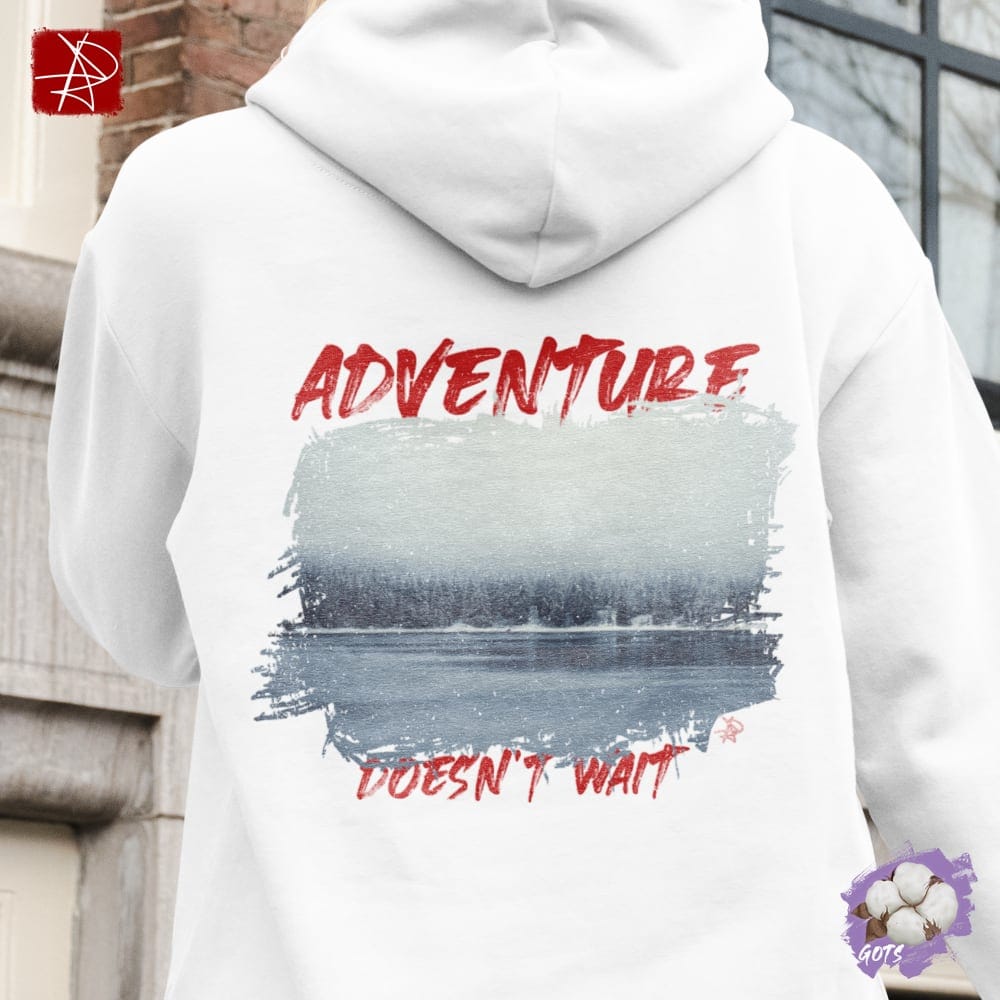 White unisex hoodie with 'Adventure Doesn't Wait' graphic, ideal for outdoor adventures, made from organic cotton.